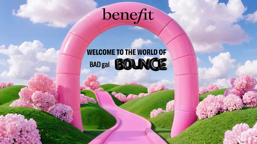 Inflatable pink Benefit archway over a pink path running through green hills into the World of Bounce