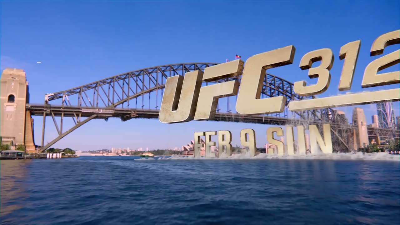 Giant UFC 312 letters standing in Sydney Harbour beside the Harbour Bridge