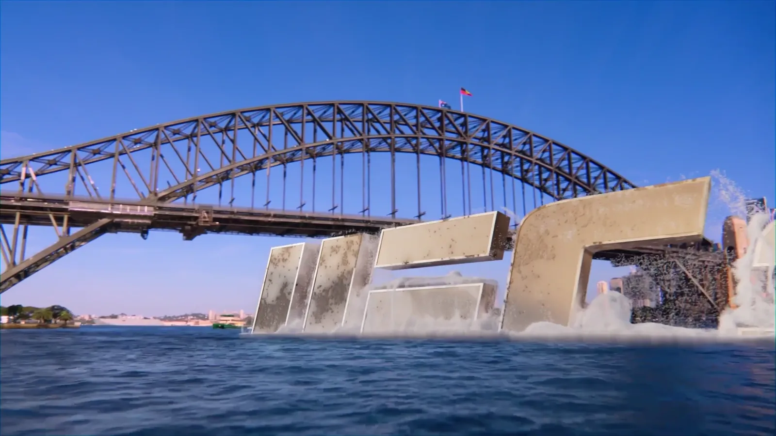 Monumental UFC letterforms beginning to rise from Sydney Harbour