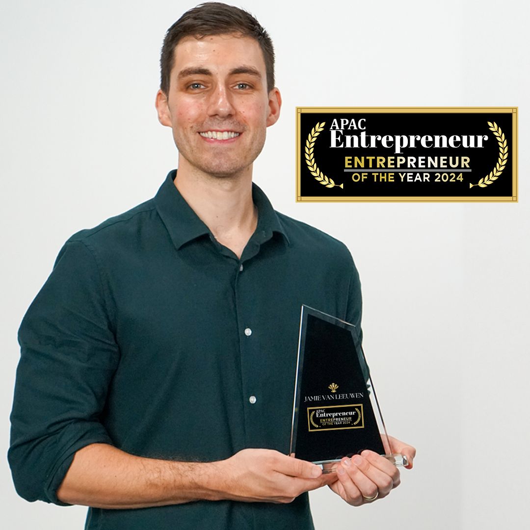 Jamie van Leeuwen holding his APAC Entrepreneur of the Year 2024 trophy